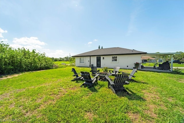 back of house with a yard