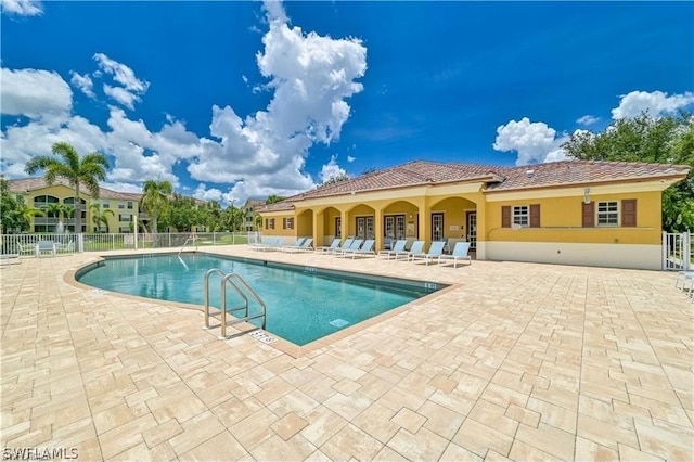 view of swimming pool featuring a patio area