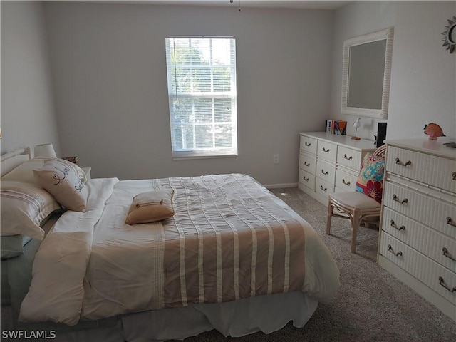 bedroom featuring light carpet