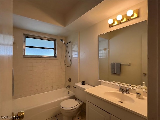 full bathroom featuring vanity, toilet, and tiled shower / bath