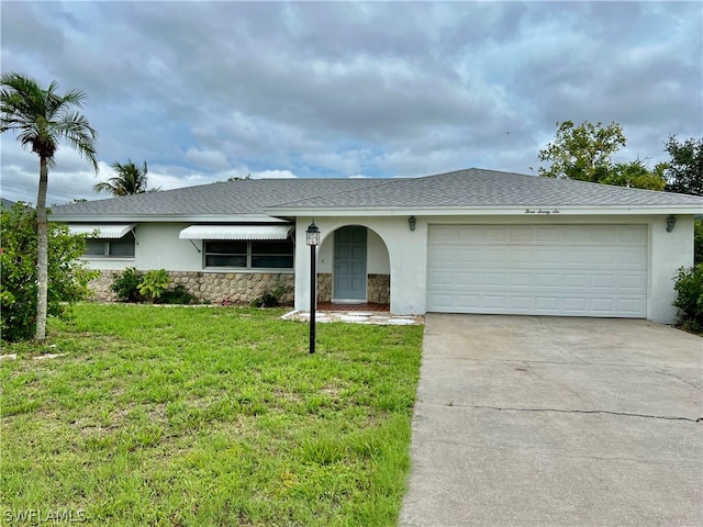 ranch-style house with a front yard and a garage