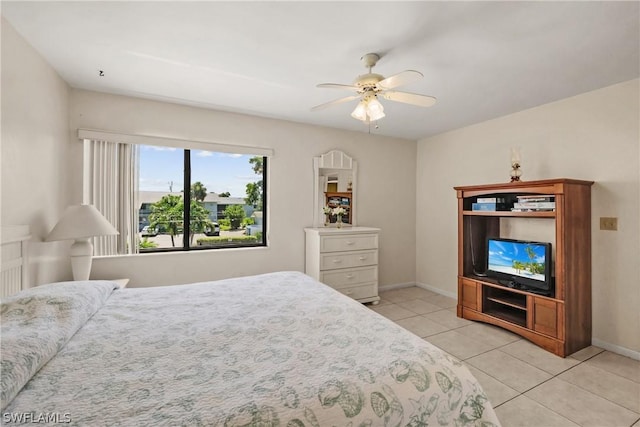 tiled bedroom with ceiling fan