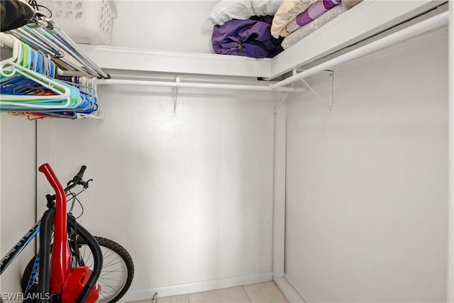 walk in closet featuring light tile patterned floors