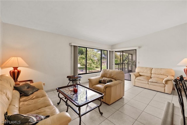 tiled living room featuring lofted ceiling