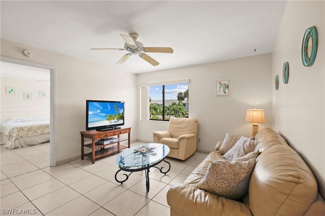 living room with ceiling fan and light tile patterned flooring