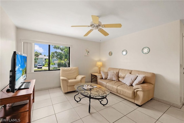 tiled living room with ceiling fan