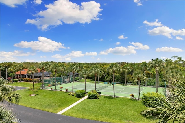 view of sport court featuring a yard