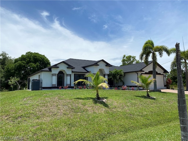 ranch-style home with central air condition unit, a front yard, and a garage