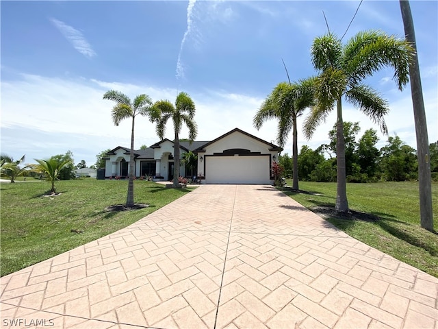 ranch-style house featuring a garage and a front yard