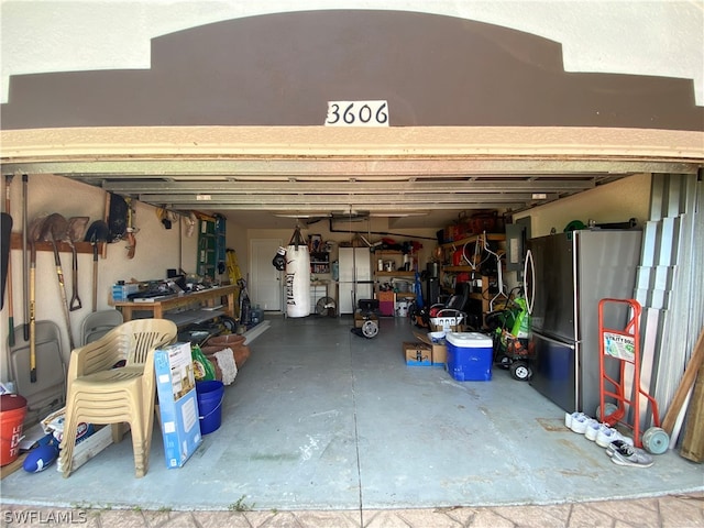 garage with stainless steel fridge