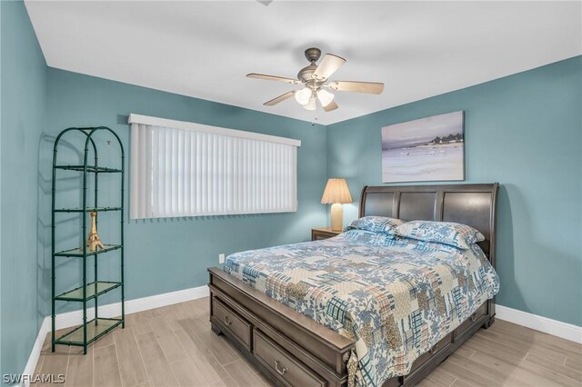 bedroom featuring light wood-type flooring and ceiling fan