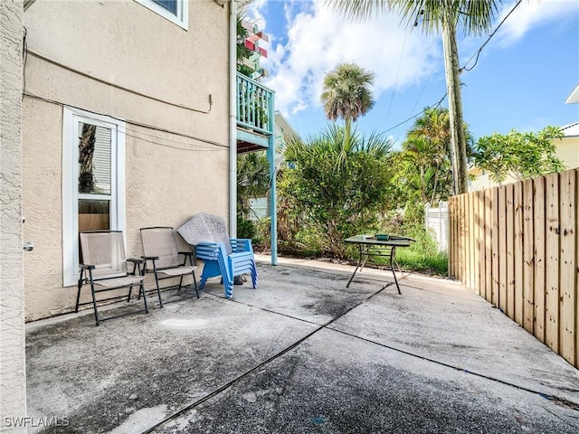 view of patio / terrace featuring fence