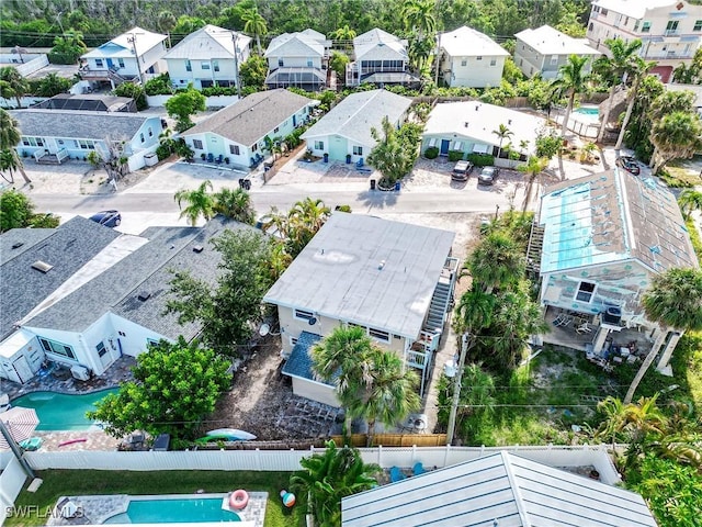 birds eye view of property with a residential view