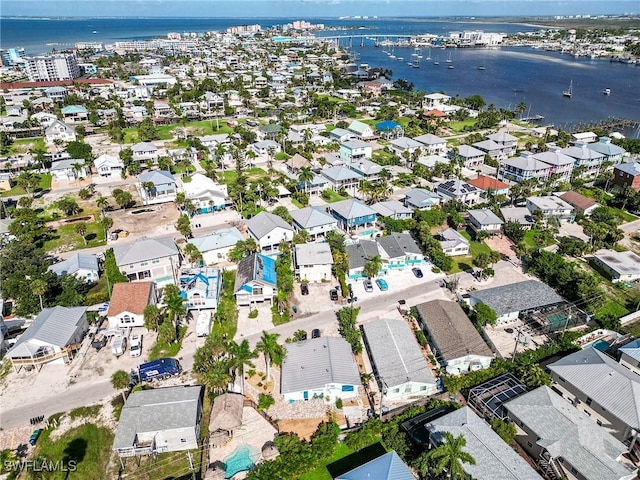 drone / aerial view with a residential view and a water view