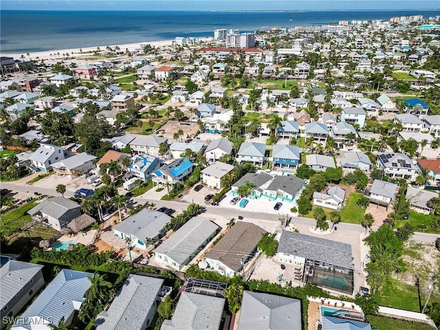 birds eye view of property with a residential view and a water view