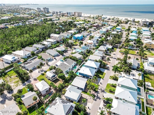 bird's eye view featuring a residential view and a water view