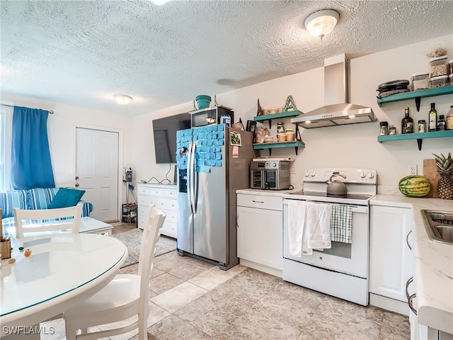 kitchen featuring ventilation hood, sink, electric range, stainless steel fridge with ice dispenser, and white cabinetry