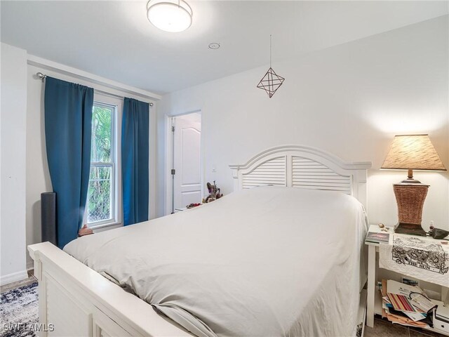 bedroom featuring baseboards