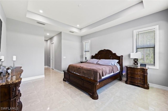 bedroom with a raised ceiling