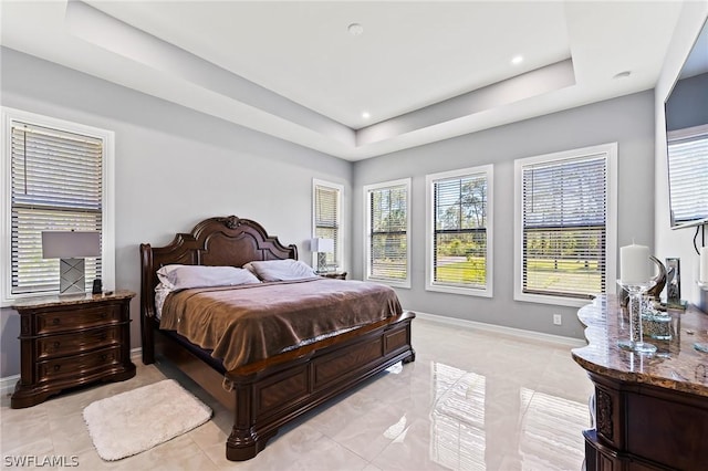 bedroom with a tray ceiling