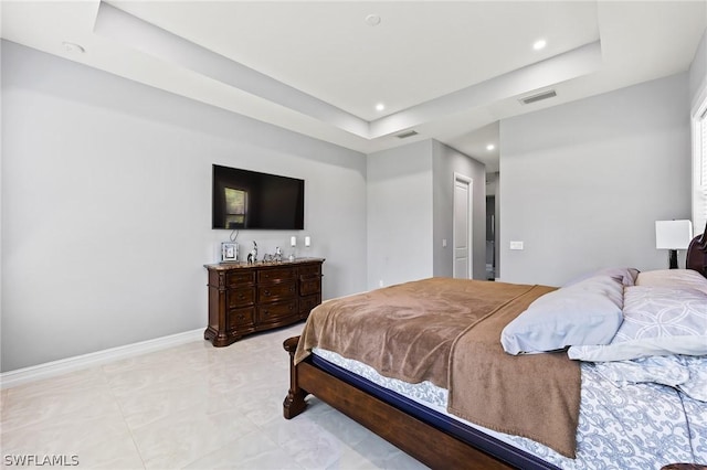 bedroom featuring a raised ceiling