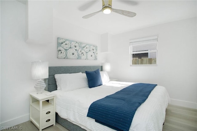 bedroom featuring ceiling fan and light hardwood / wood-style flooring