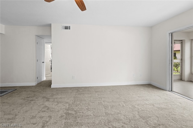 spare room with carpet flooring and ceiling fan