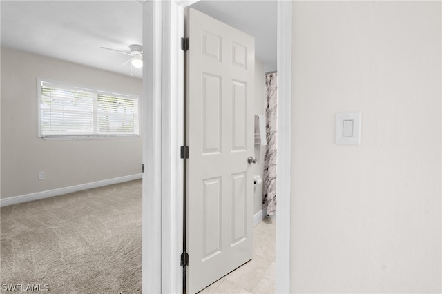 hallway with light tile patterned floors