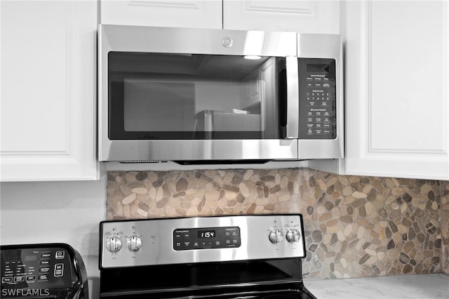 details with backsplash and white cabinets