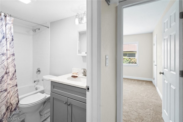 full bathroom featuring shower / bath combo with shower curtain, vanity, and toilet