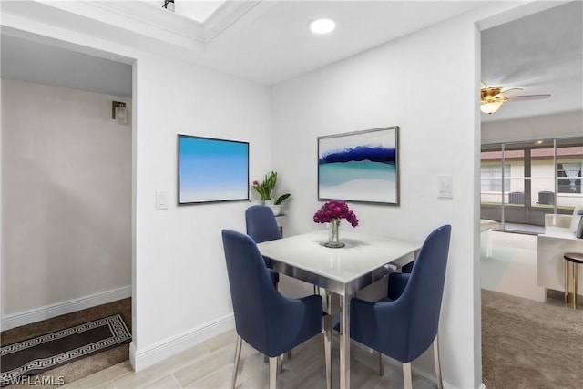 dining room featuring crown molding and ceiling fan