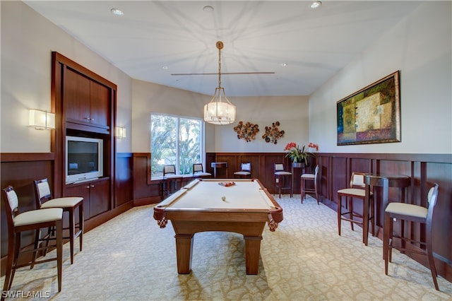 game room with light carpet, wooden walls, and billiards