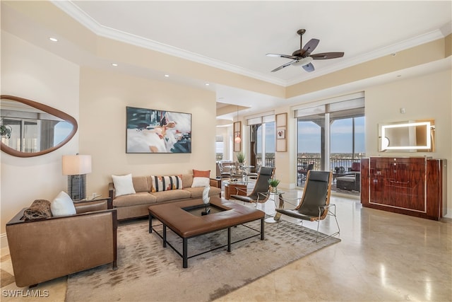 living room with crown molding and ceiling fan