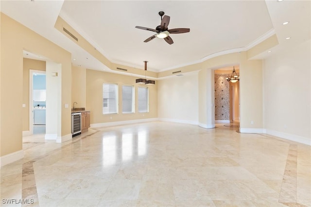 14270 Royal Harbour Ct Unit 1122, Fort Myers, FL 33908 - unfurnished living room with wine cooler, ornamental molding, a sink, light marble finish flooring, and a chandelier