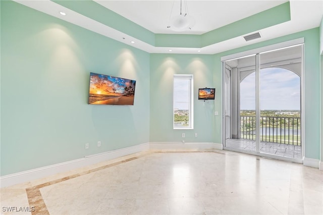 14270 Royal Harbour Ct Unit 1122, Fort Myers, FL 33908 - unfurnished room featuring baseboards, a tray ceiling, recessed lighting, and inlaid floor details