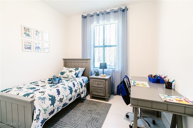 bedroom featuring light tile patterned flooring