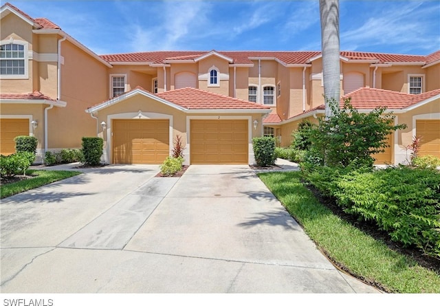 mediterranean / spanish-style house featuring a garage