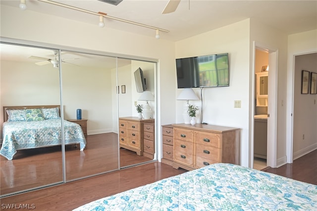 bedroom with a ceiling fan, a closet, baseboards, and wood finished floors