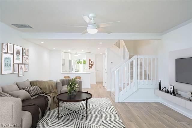 living area featuring recessed lighting, visible vents, stairway, a ceiling fan, and light wood-type flooring