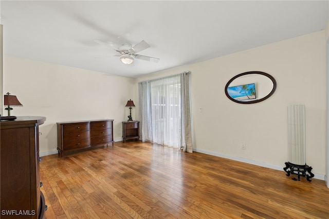 bedroom with hardwood / wood-style flooring and ceiling fan