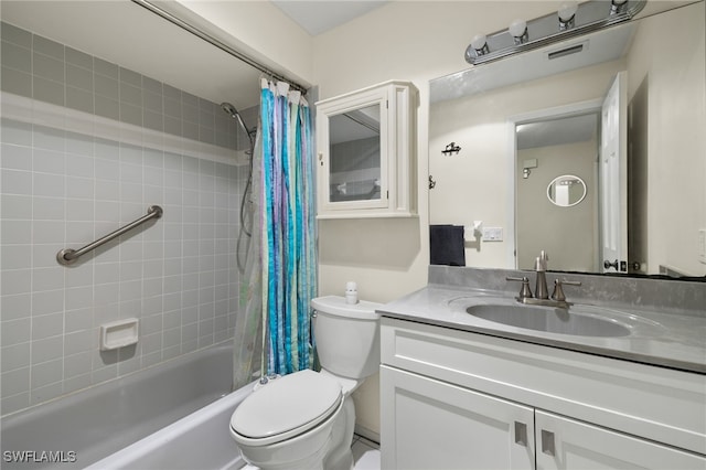 full bathroom featuring shower / tub combo, toilet, and vanity