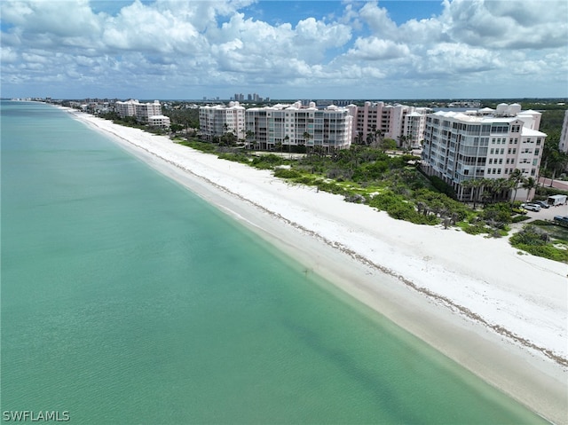 birds eye view of property featuring a view of the beach and a water view