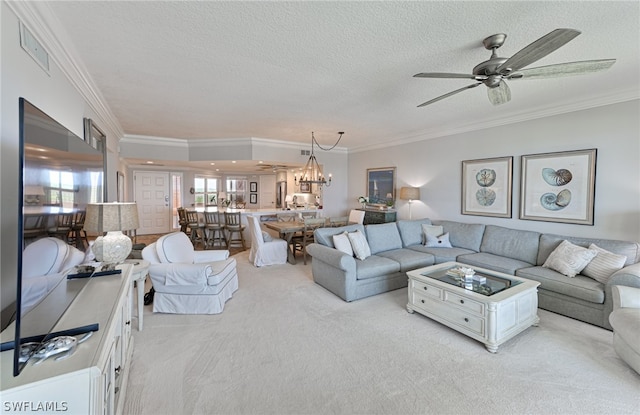 living room featuring light carpet, ceiling fan with notable chandelier, and ornamental molding