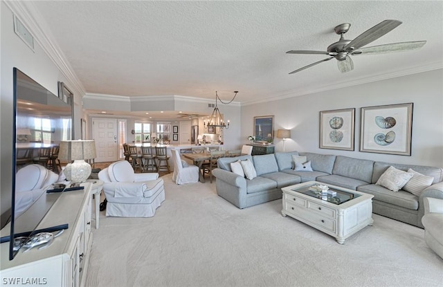 living room with visible vents, light colored carpet, crown molding, a textured ceiling, and ceiling fan with notable chandelier