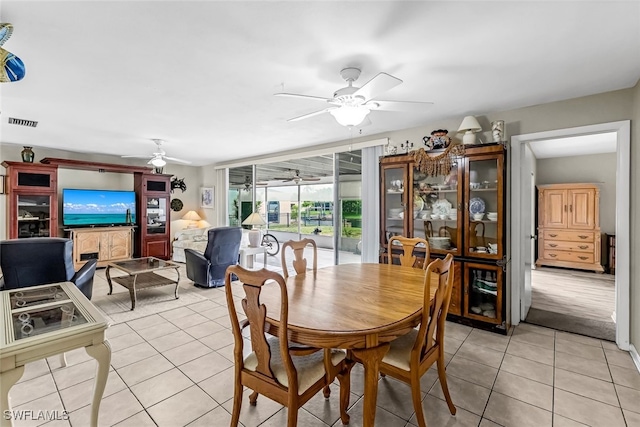 dining space with light tile patterned floors