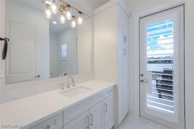 bathroom featuring tile patterned floors and vanity