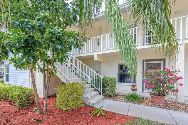 view of property featuring stairs