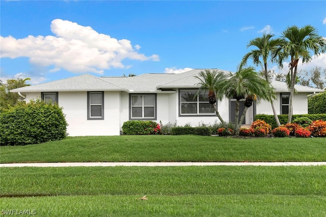 single story home with a front yard