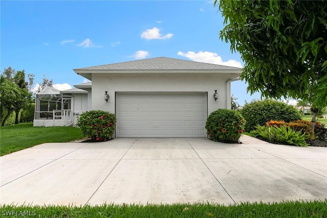 exterior space featuring stucco siding, a front lawn, concrete driveway, and a garage