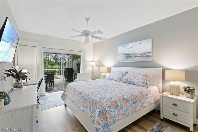 bedroom featuring ceiling fan, wood finished floors, and access to exterior